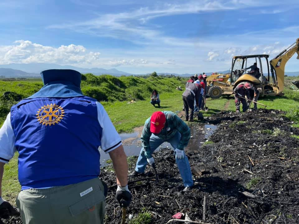 Rotary volunteers clearing debris during a river cleanup