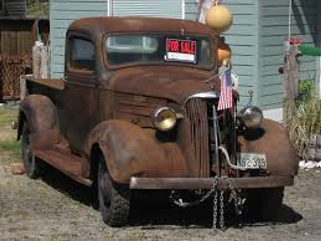 An old car in rough condition, still eligible for donation